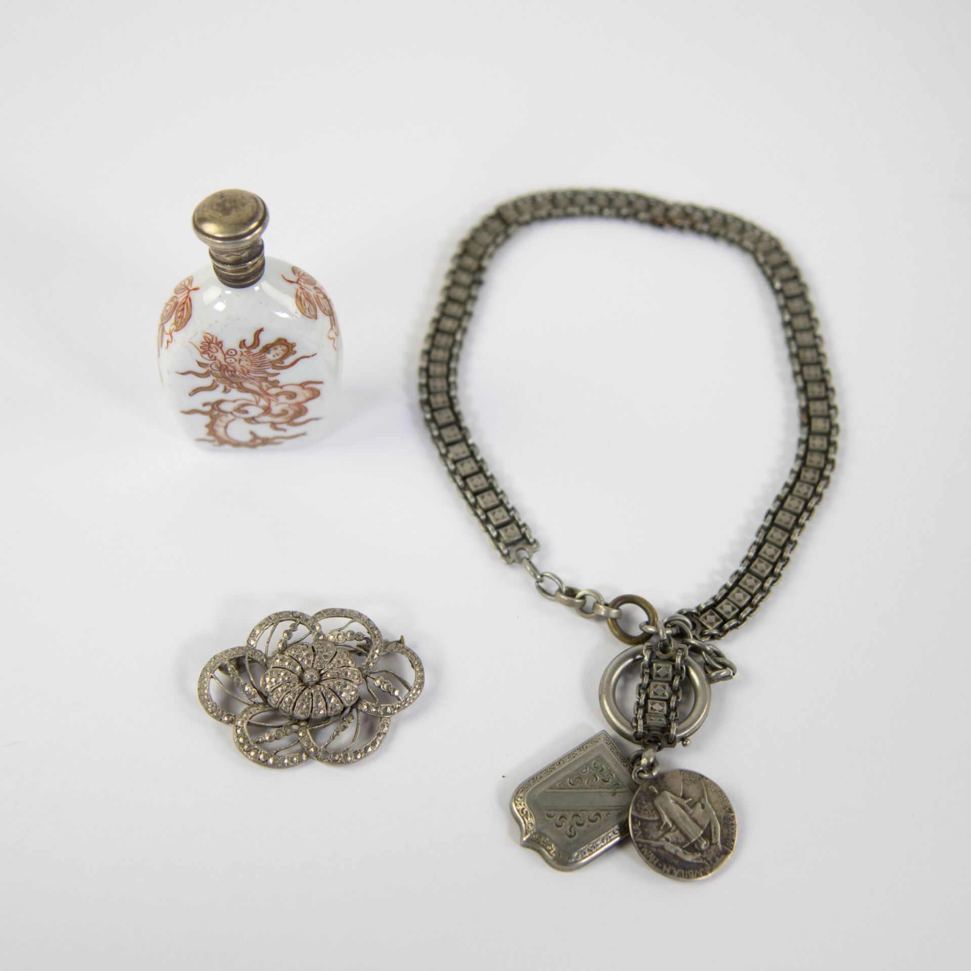 Watch chain in silver, brooch and perfume bottle