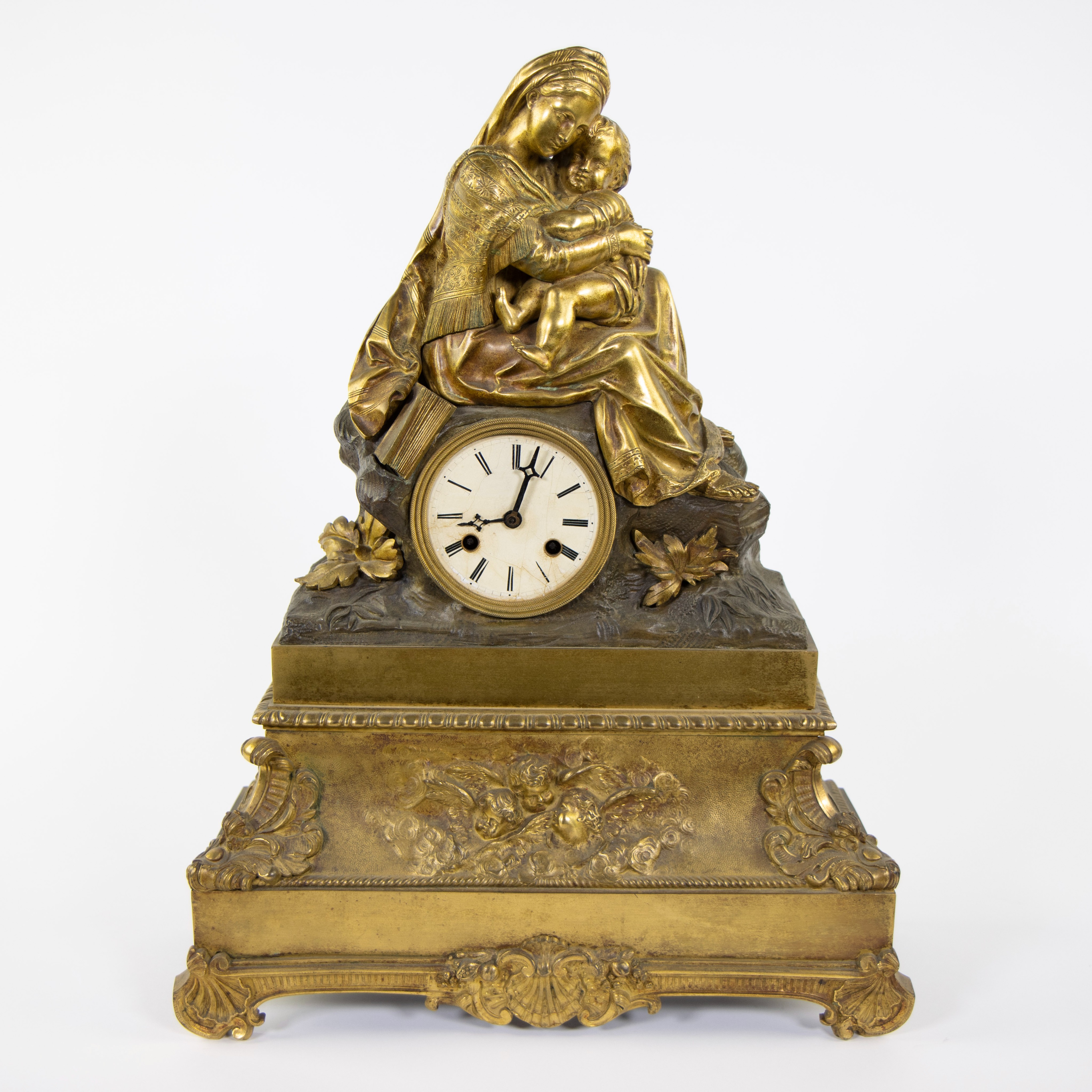 Gilt bronze Louis Philippe mantel clock with mother and child decor, Paris 19th century