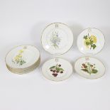 Set of 9 Limoges plates with hand-painted floral decor, with decorated initials, 19th century.