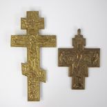 A bronze Russian Orthodox icon cross with a central relief depicting the Crucifixion of Christ and R