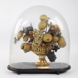 Openwork gilded porcelain basket with ornamental fruit under a glass dome