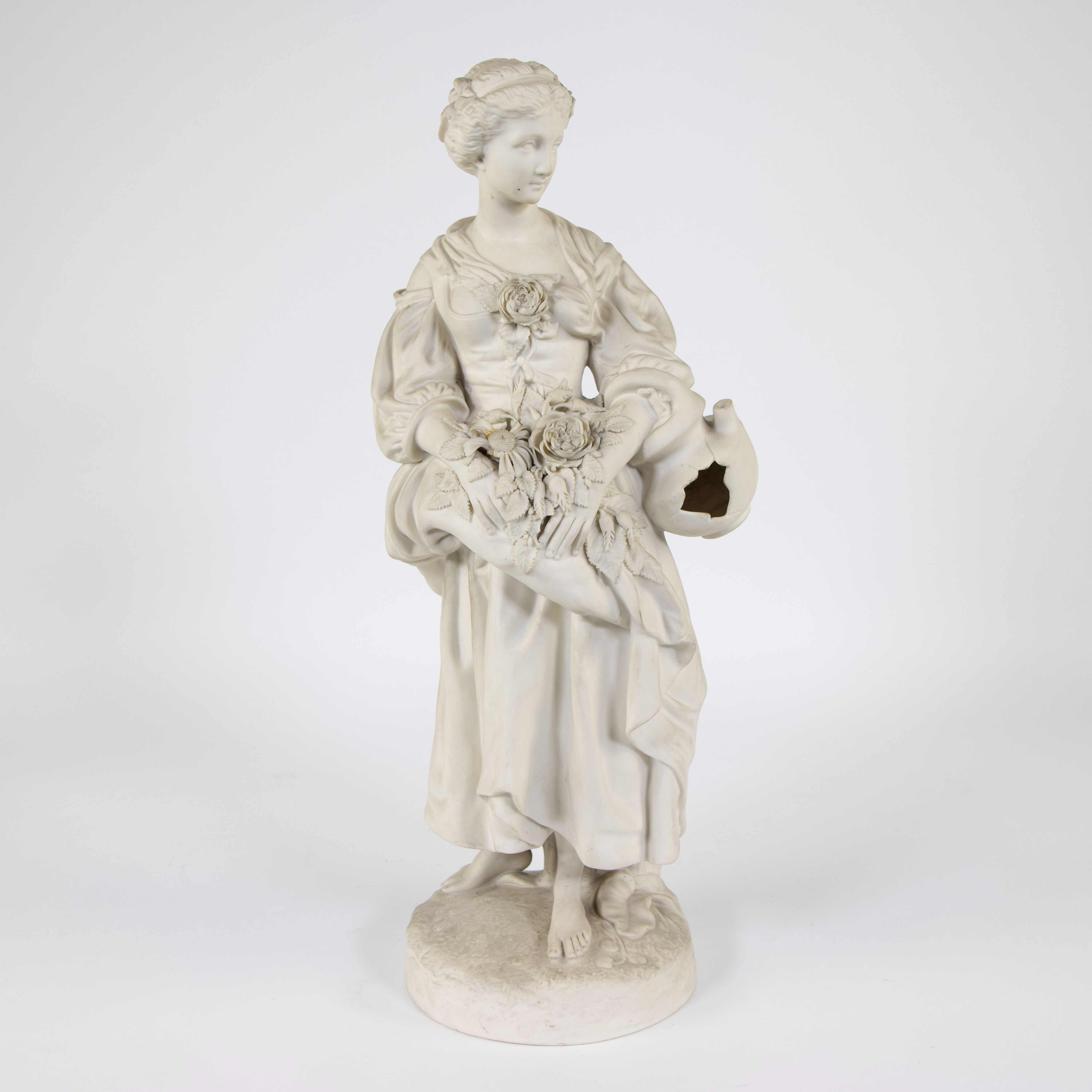 Biscuit figurine of a lady with flowers and jug