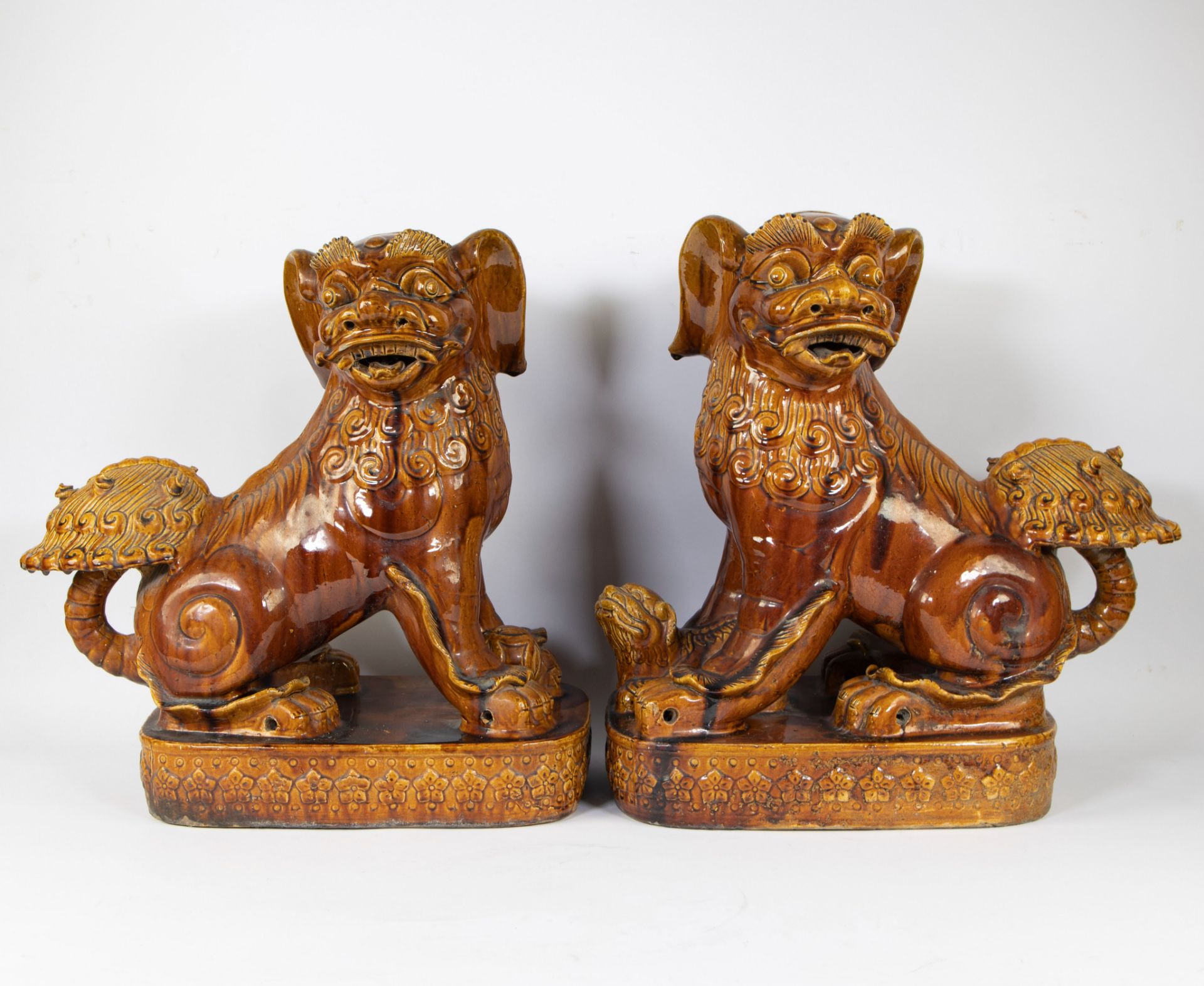 Pair of Vietnamese Foo dogs in glazed earthenware