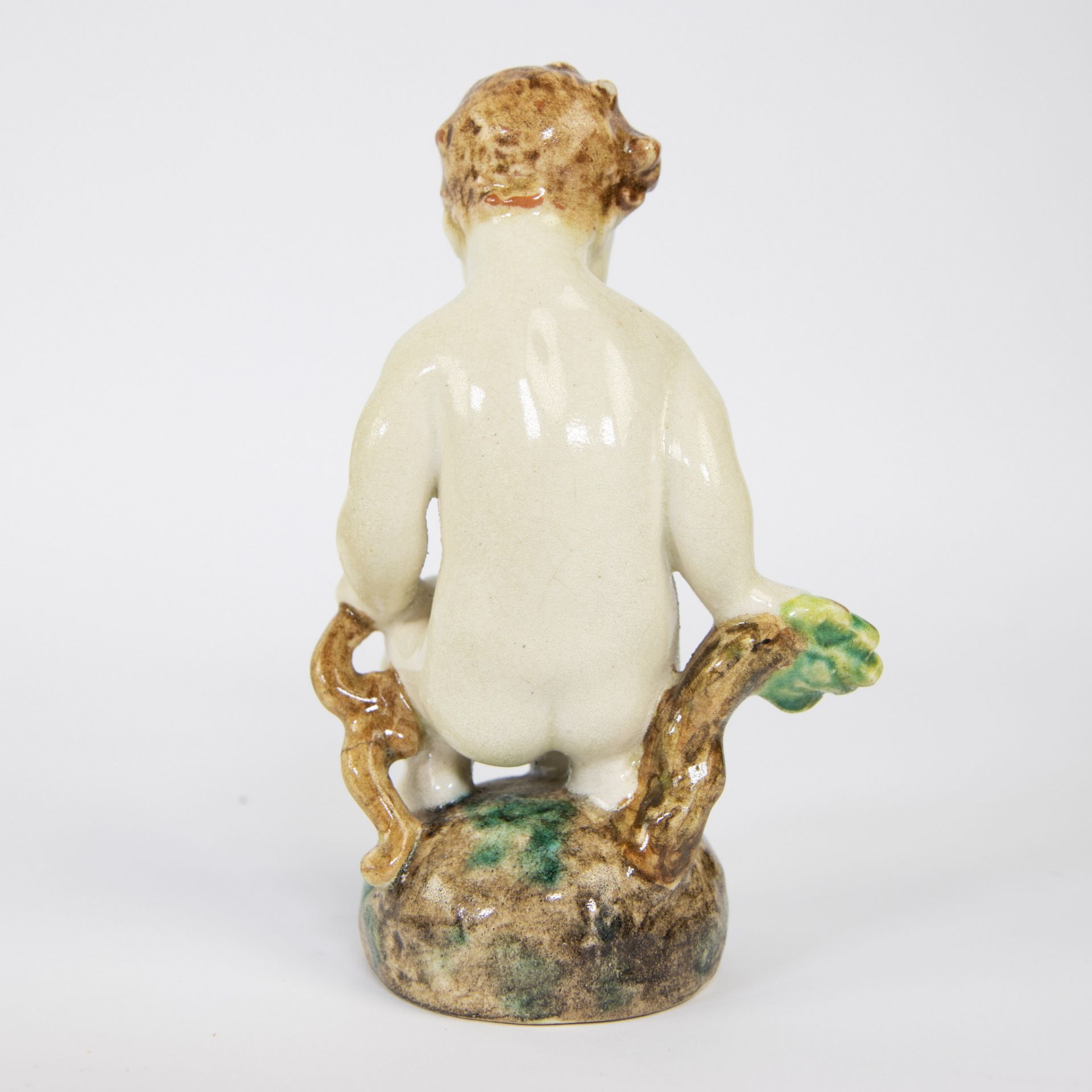A ceramic figure of a seated child, Karlsruher Majolika, marked - Image 3 of 5
