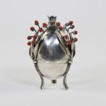 A Russian Silver Egg by Josef Sosnkowski. The egg is inset with flower stems inlaid with cabouchon r