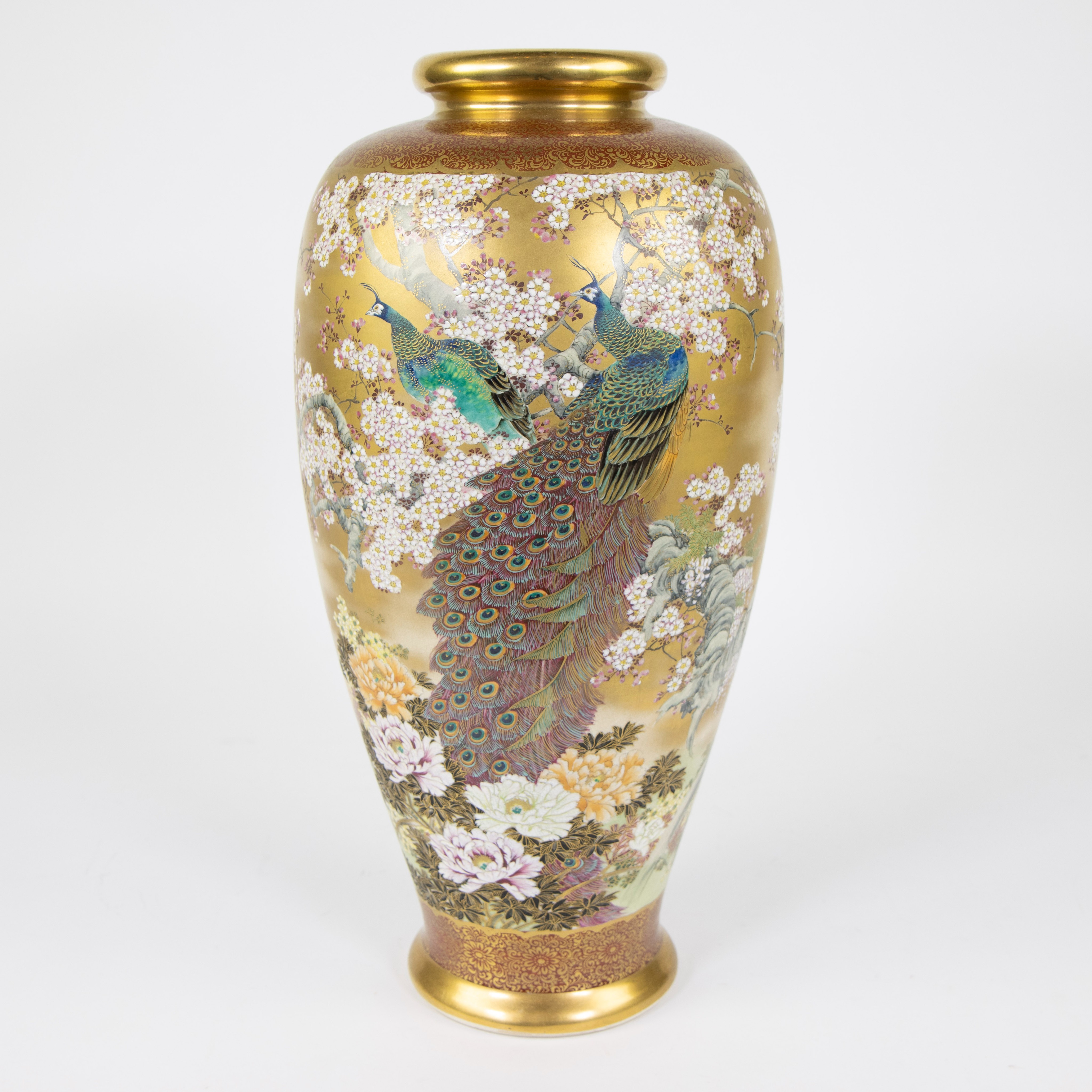 Porcelain vase, fine, hand-painted decor of peacocks and flowers on a gold background, signed