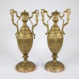 Pair of large gilded ornamental vases on alabaster base