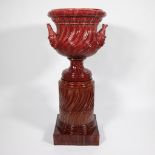 Imposing ornamental vase on column in glazed burgundy ceramic/terracotta