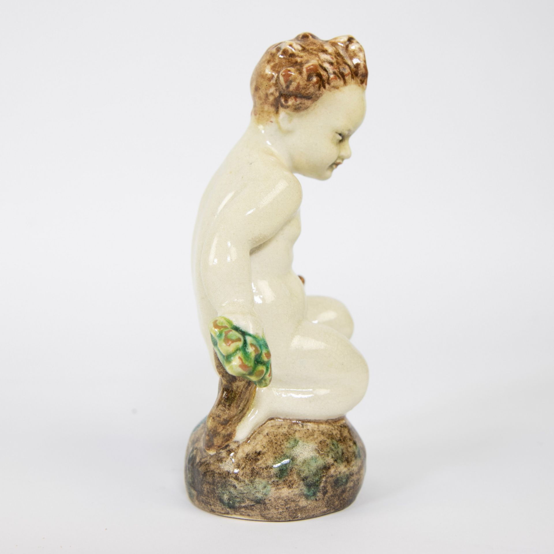 A ceramic figure of a seated child, Karlsruher Majolika, marked - Image 4 of 5