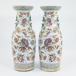 pair of baluster shaped porcelain vases, decorated in polychrome enamels with blossoming coral bark