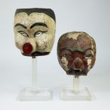 2 Indonesian masks on plexi stand