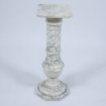 White and black-veined marble column