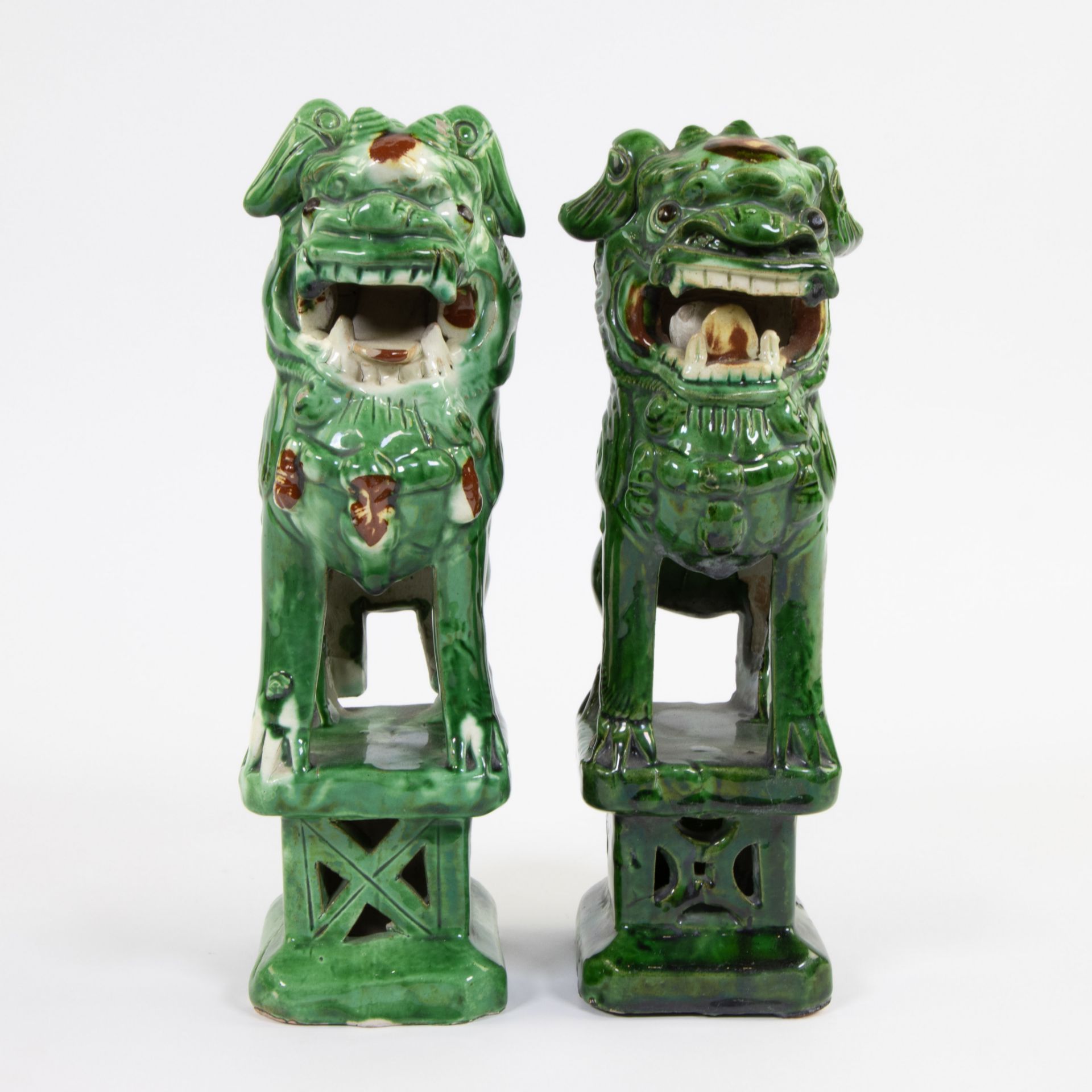 Collection of 2 green glazed ceramic Pho dogs