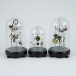 Lot of 3 globes with sculptures of clockwork parts