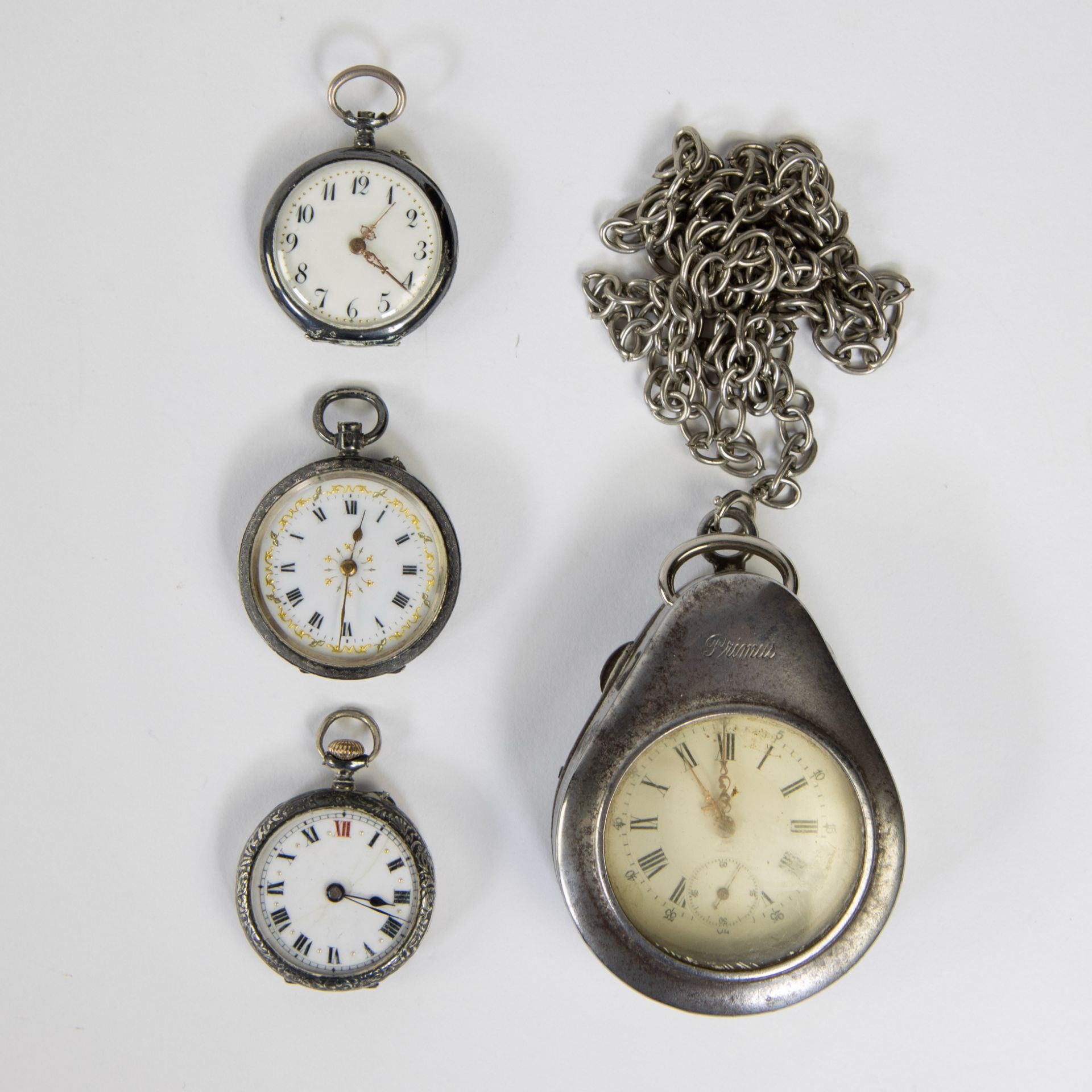 4 pocket watches, 3 of which are silver