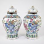 Pair of Samson lidded famille rose vases with decoration of pheasant on blue rock, 19th century