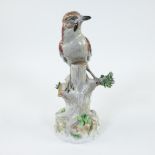 Beautiful, colourful porcelain bird on a tree stump, marked Dresden