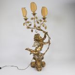Large gold-plated wooden candlestick with 3 lights and decorated with putto and swinging branch with
