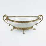 Large glass oval coupe with geometric motif decorated with a gilt bronze frame with branch and leaf