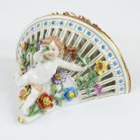 Porcelain wall console decorated with finely elaborated flowers and putto, Dresden, marked