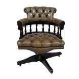 Captains swivel chair, typical English Chesterfield swivel office chair with green leather upholster