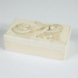 Ivory tobacco box with a relief decoration of 2 playing monkeys