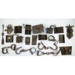 Collection of antique locks and iron handcuffs