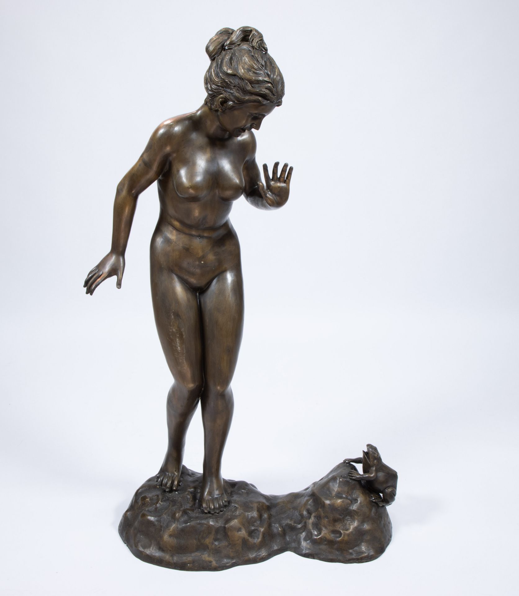 Exceptionally large brown patinated statue of nude woman with frog