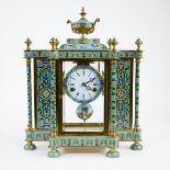 Gilt brass cloisonné table clock with beautifully painted pendulum with ladies' head, dial in Romane