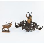 Wood carved stag and cape decorated with deer head from Lake Thuner, Switzerland