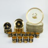 A beautiful set porcelain gilded plates and cups, made by Delvaux Paris