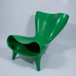 The green Orgone Chair by Marc Newson, plastic, marked