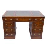 English mahogany desk with inlaid leather top and three drawers and two drawer blocks each with thre