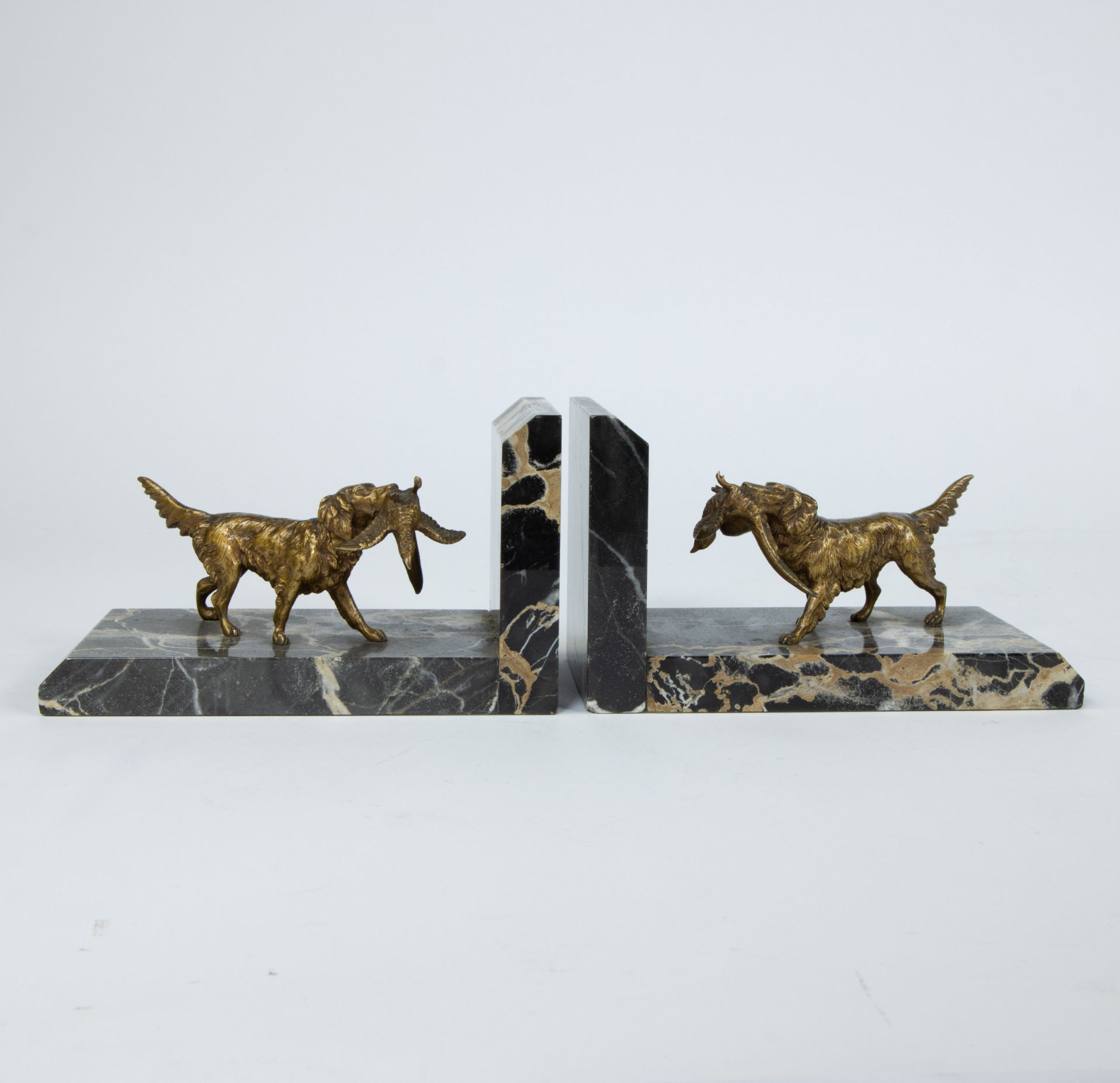 Claude Marie DEVENET (1851-?), pair of gilt bronze bookends depicting hunting dogs, signed in the ma