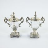 Ornate sugar set consisting of 2 beautifully cut crystal glasses with richly worked silver feet on 4