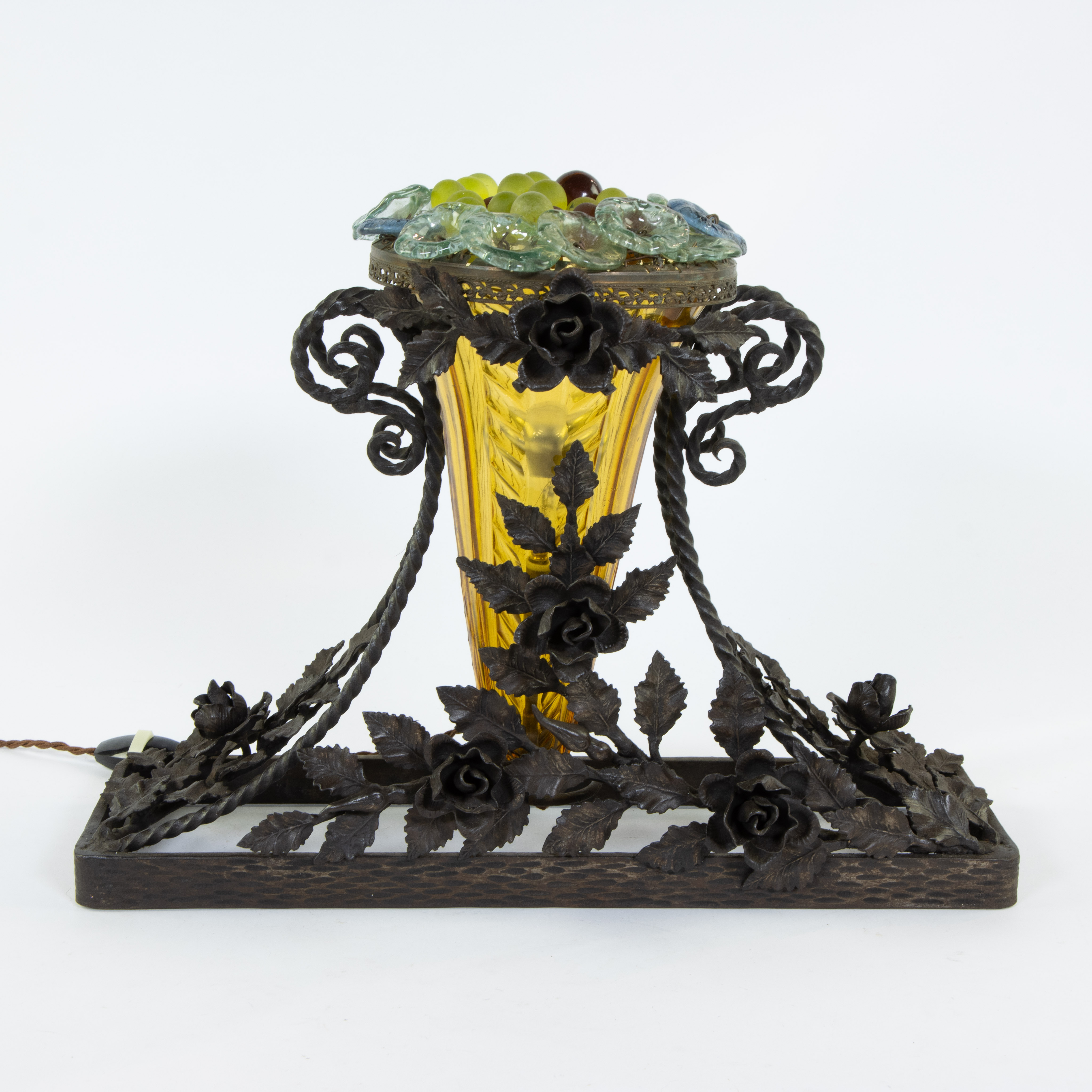 Yellow glass Art Deco vase as lamp in wrought iron frame decorated with leaves and floral motifs