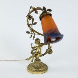 Art Nouveau table lamp in the shape of a swinging flower branch with child in gilt brass with shade