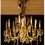 Antique chandelier in gilt brass with crystal bells