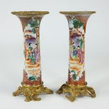 Pair of Chinese vases famille rose with mandarin decor and gilt bronze mount, 19th century