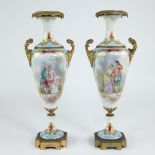 Pair of 19th-century French porcelain vases with hand-painted romantic decor and gilt bronze mounts,