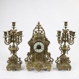 A Napoleon III style brass clock set comprising a mantel clock and two four-armed candlesticks, mark