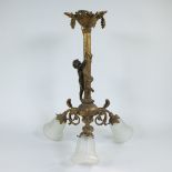 Chandelier in gilt brass with decor of child climbing towards bunches of grapes, three light fitting
