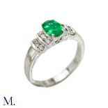 An Emerald and Diamond Ring