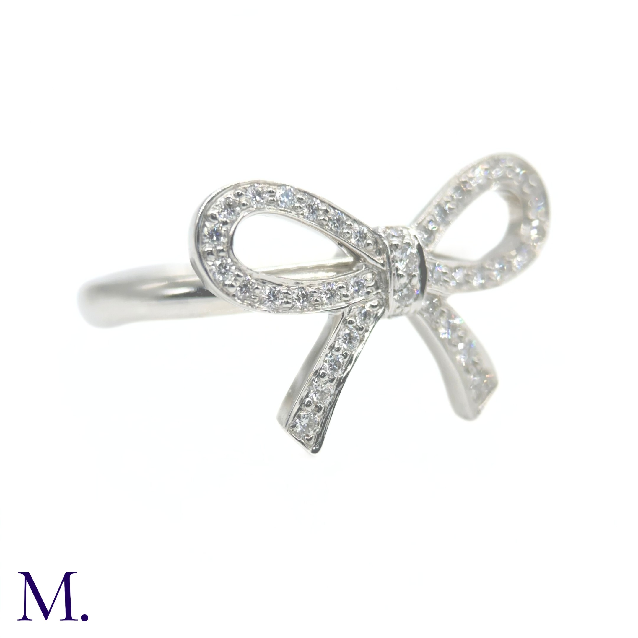 A Platinum and Diamond Bow Ring by Tiffany & Co. - Image 3 of 4