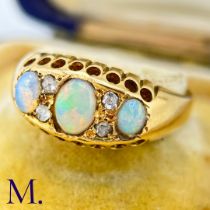 An Antique Opal and Diamond Ring The 18ct yellow gold ring is set with three good colour opals