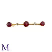 An Antique Garnet and Diamond Bar Brooch This 9ct yellow gold brooch is set with three deep purple-