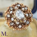 An Antique Rose Diamond Cluster Ring The yellow gold ring is set with rose diamonds, the largest