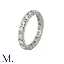 A Diamond Eternity Band The 18ct white gold band is set with approximately 1.0ct of round cut