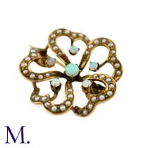 An Opal and Pearl Brooch The floral patterned openwork brooch in 9ct yellow gold is set with good