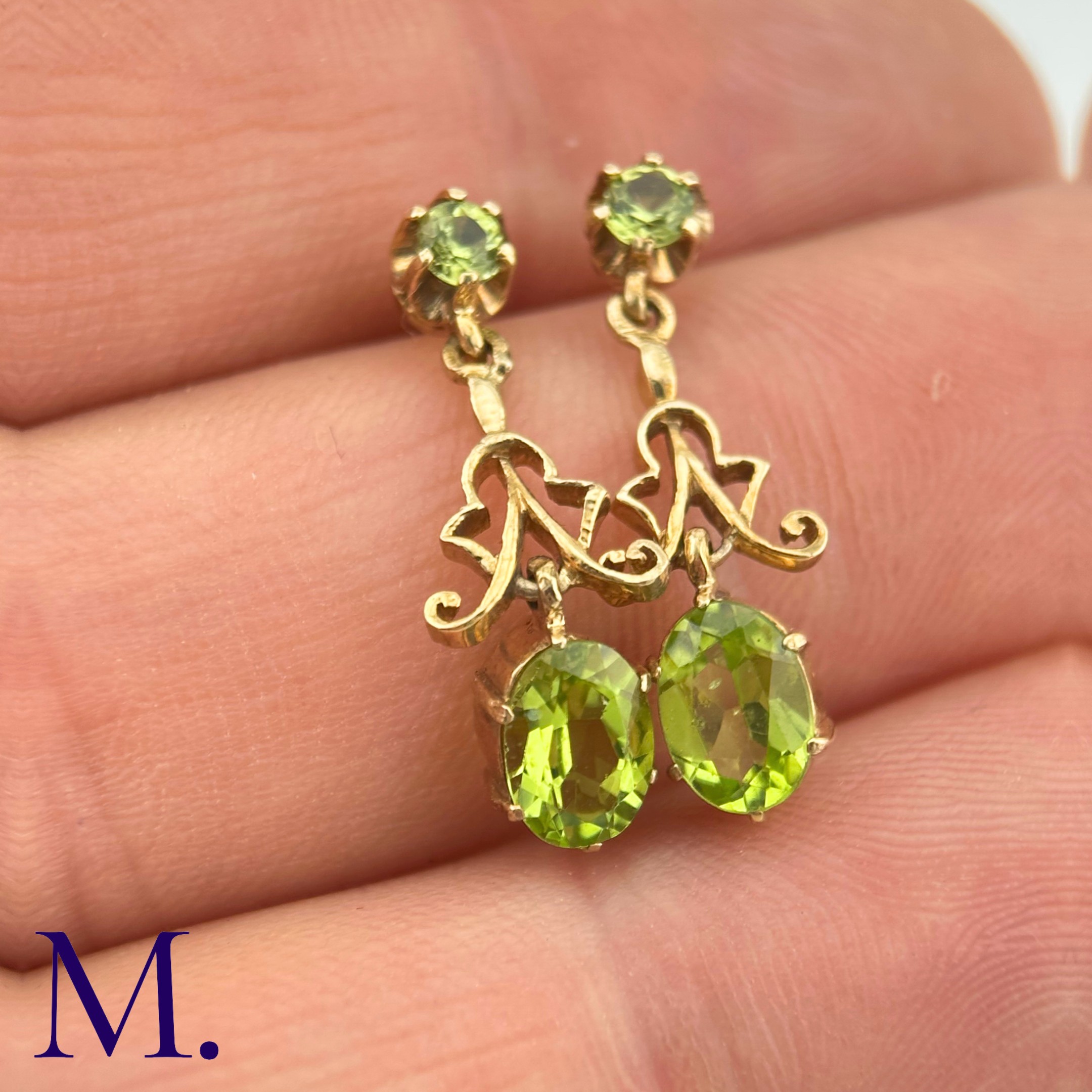 A Pair of Antique Peridot Earrings The peridot earrings are set in 9ct yellow gold. The earrings are - Image 2 of 4